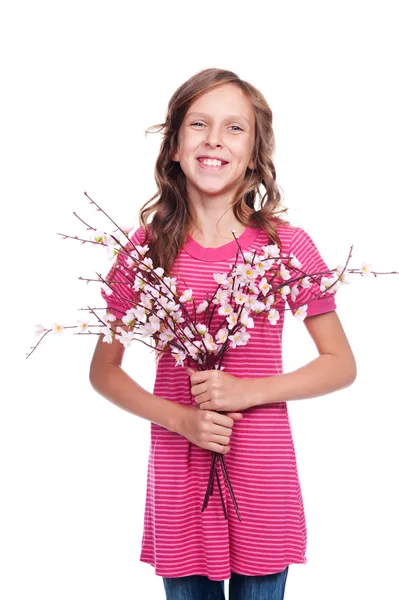 Söt flicka med vårblommor — Stockfoto