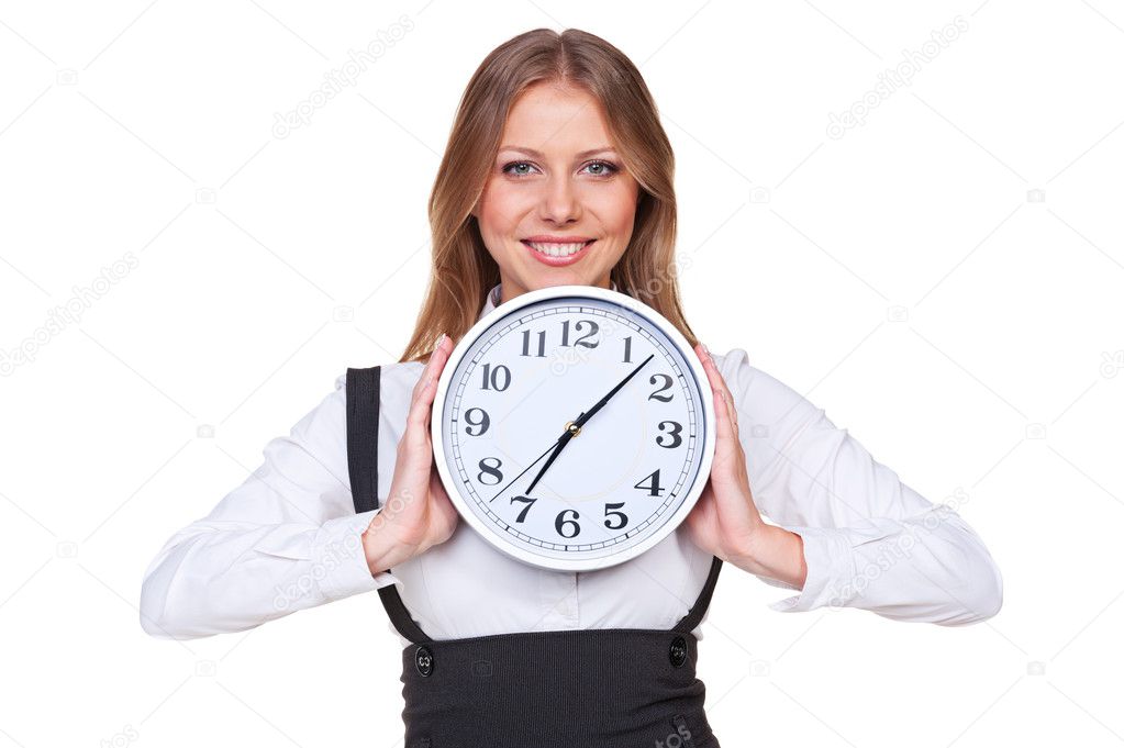 woman holding the clock and smiling