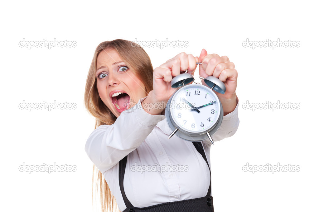 woman holding alarm clock in panic