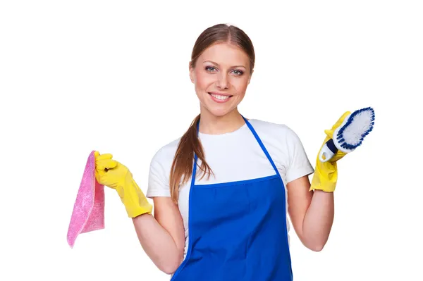 Charlady sonriente con alfombra y cepillo —  Fotos de Stock