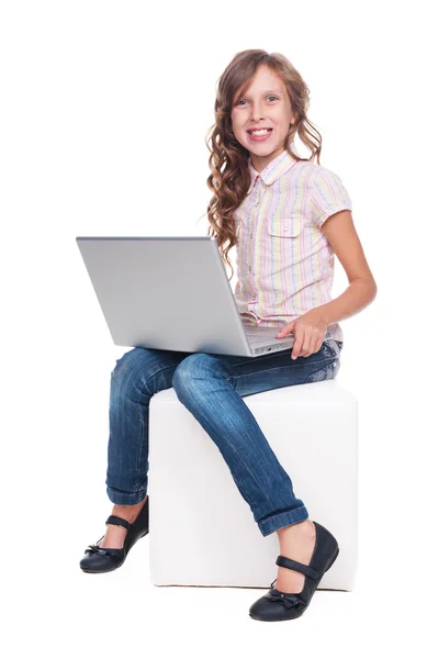 Excited girl sitting on chair — Stock Photo, Image