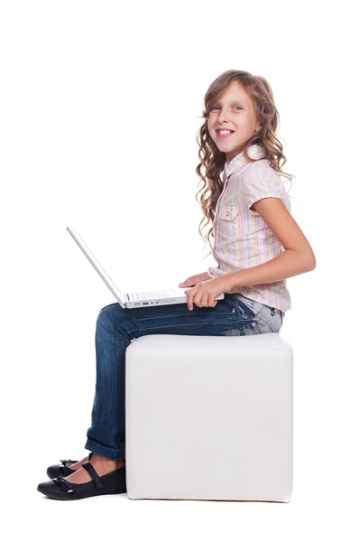 Pretty smiley schoolgirl with laptop — Stock Photo, Image