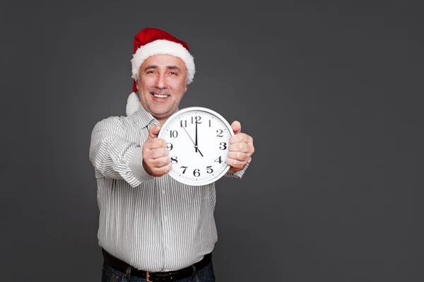 Happy senior man in christmas hat — Stock Photo, Image