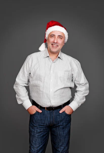 Senior man in santa hat — Stock Photo, Image