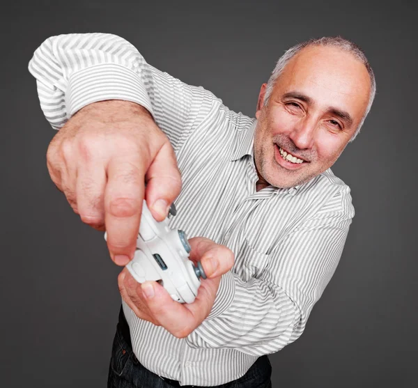 Jovial man oncentrated on gaming — Stock Photo, Image