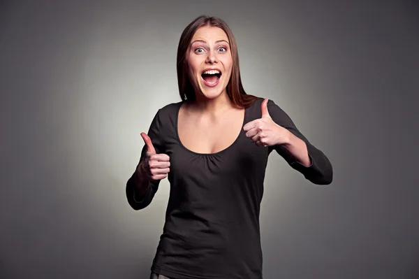 Excited woman showing thumbs up — Stock Photo, Image