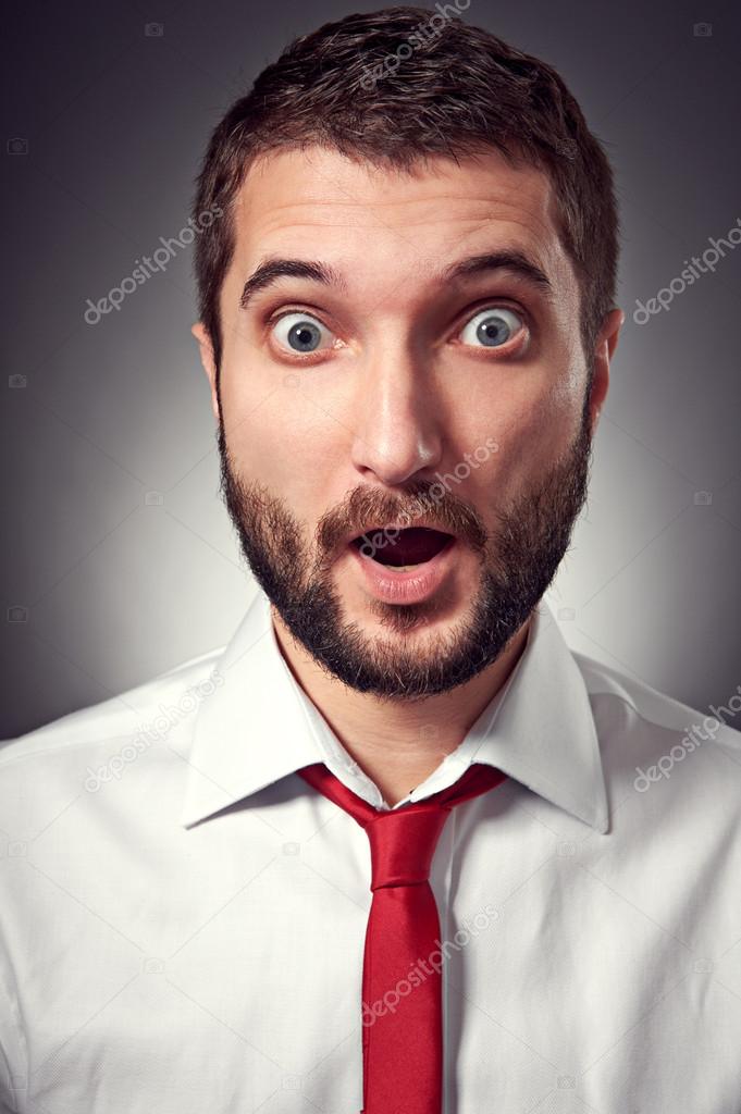 surprised man over grey background