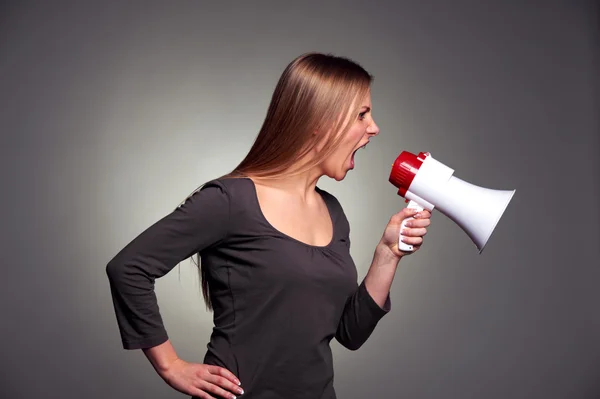 Woman shouting in loudspeaker — Stock Photo, Image