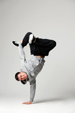 hip-hop dancer over grey background clipart