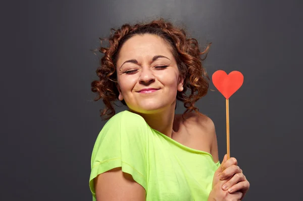 Woman holding small red heart Stock Photo