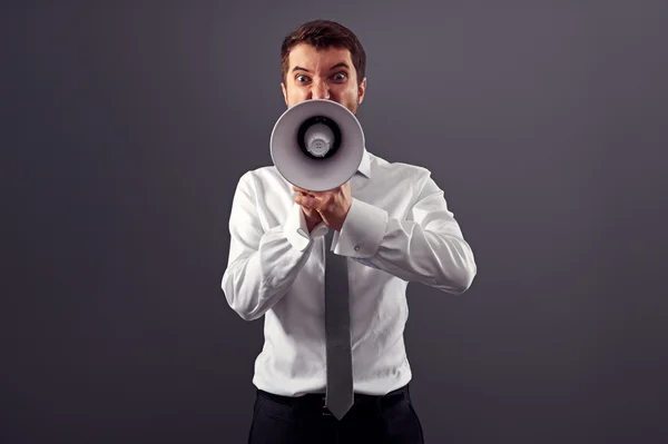 Homem zangado emocional gritando com megafone — Fotografia de Stock