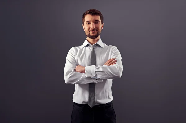 Guapo hombre de negocios con las manos dobladas — Foto de Stock