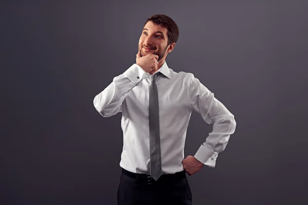 Businessman looking up and smiling Stock Picture