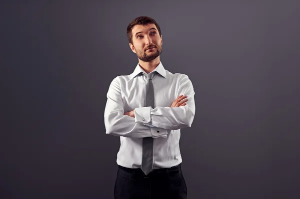 Man with folded hands looking up Stock Picture