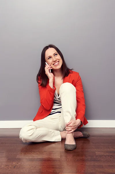 Girl sitting on the floor — Stock Photo, Image