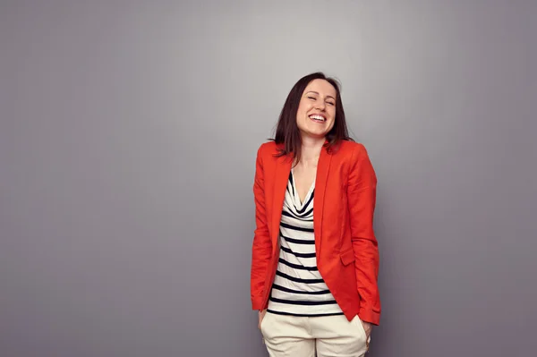 Laughing brunette standing — Stock Photo, Image