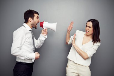 boss screaming in megaphone at the woman clipart