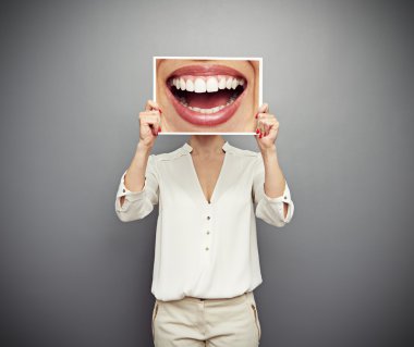 woman holding picture with big smile clipart
