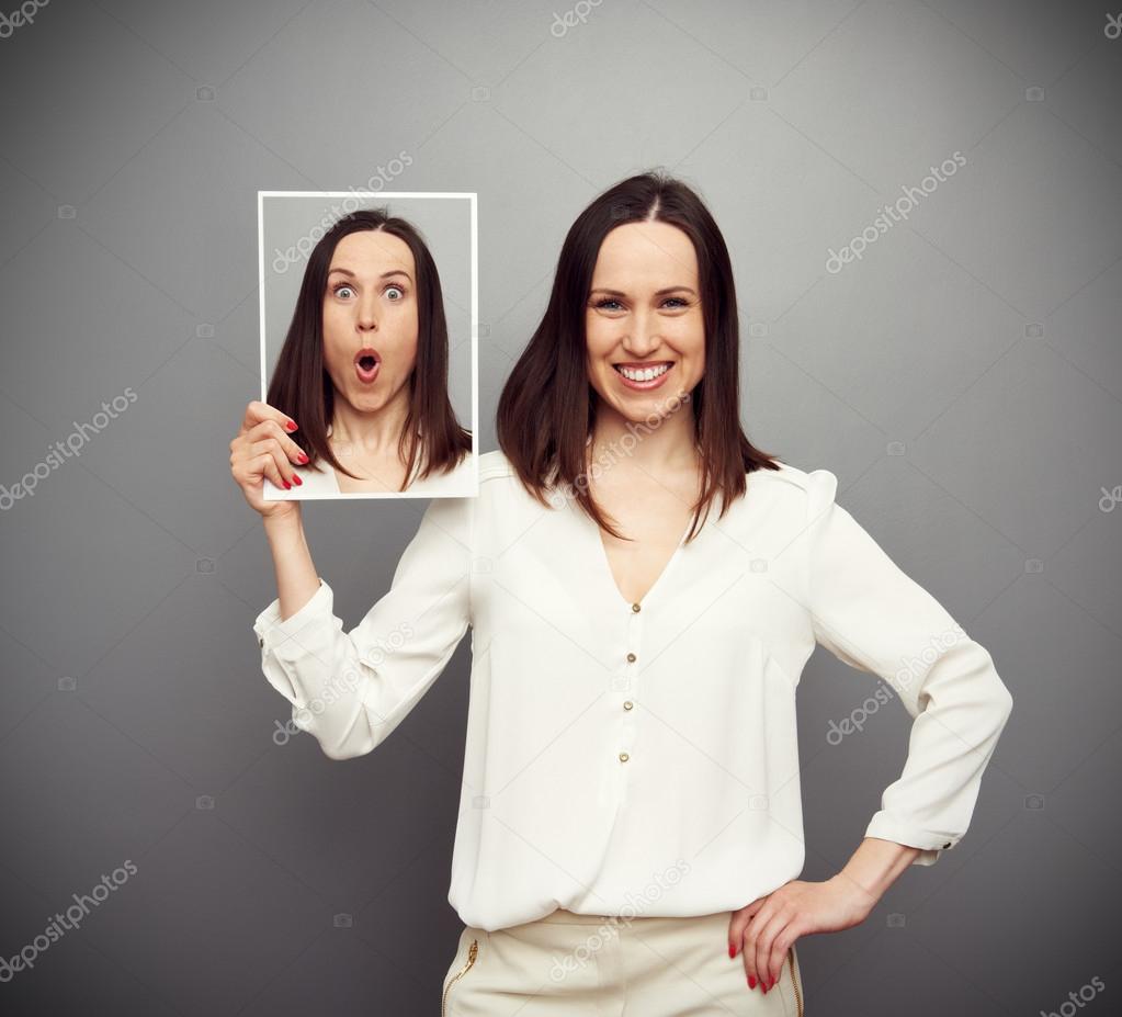 smiley woman hiding her amazement