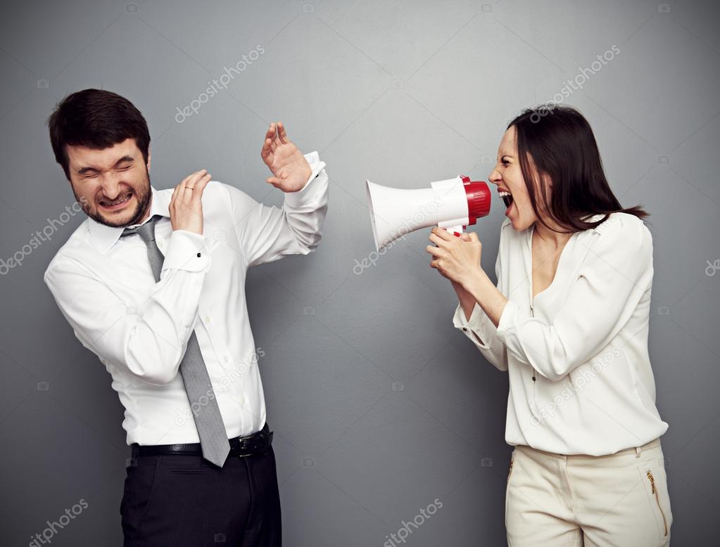 woman screaming in megaphone at the man