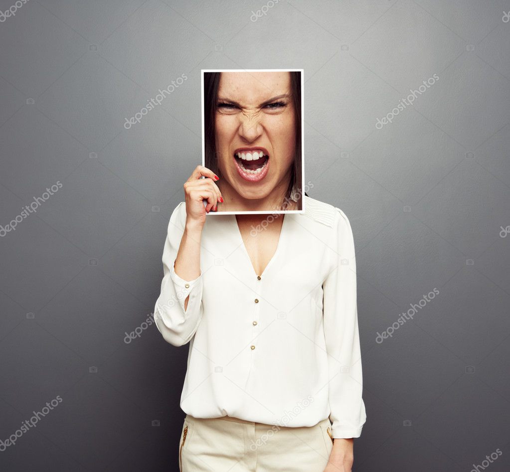 woman covering image with big angry face