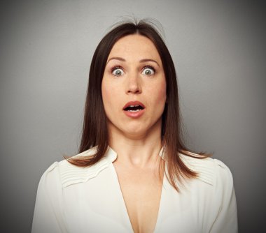 frightened woman looking at camera clipart