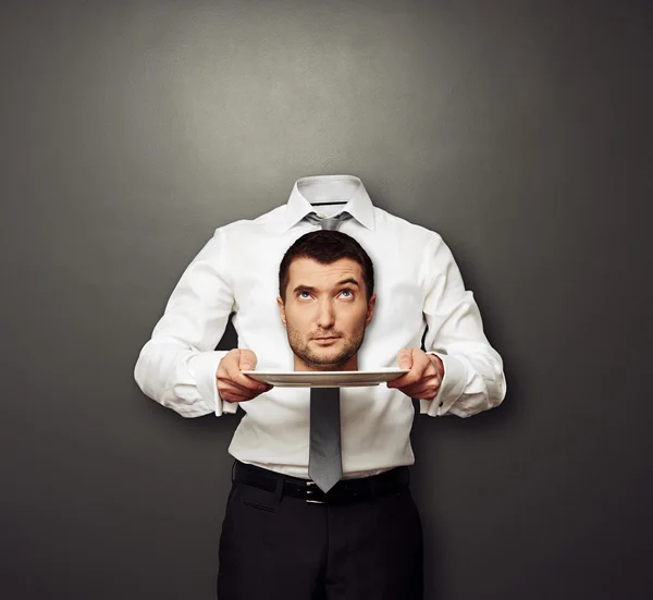 Head on the white plate looking up — Stock Photo, Image