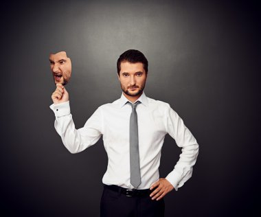 man holding mask with bad mood clipart