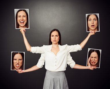 woman holding pictures with different mood clipart