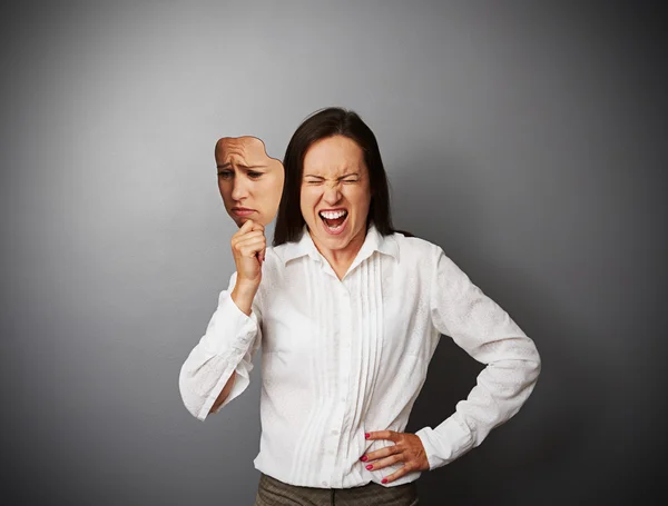 Businesswoman hiding her anger — Stock Photo, Image