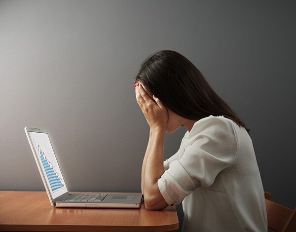 woman covering her face by the hands