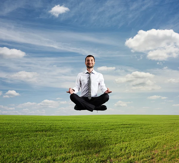 Man hover over green field — Stock Photo, Image