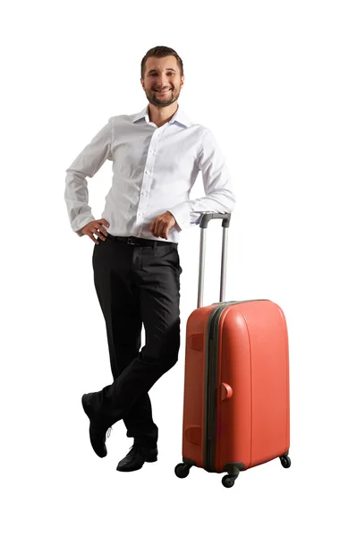 Happy man standing with suitcase — Stock Photo, Image