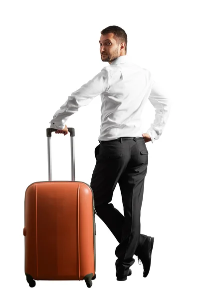 Man holding suitcase and looking around — Stock Photo, Image