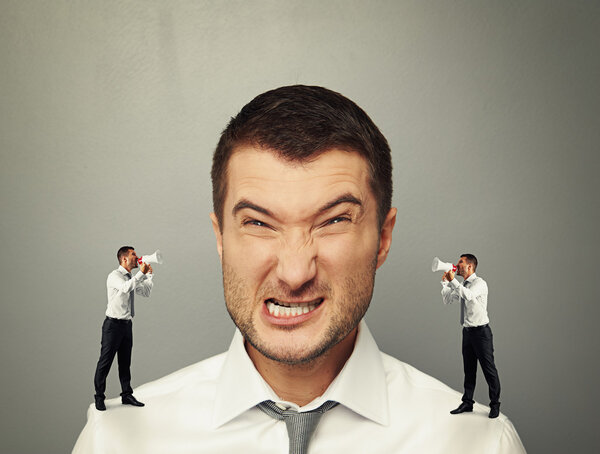 little men screaming at big angry man