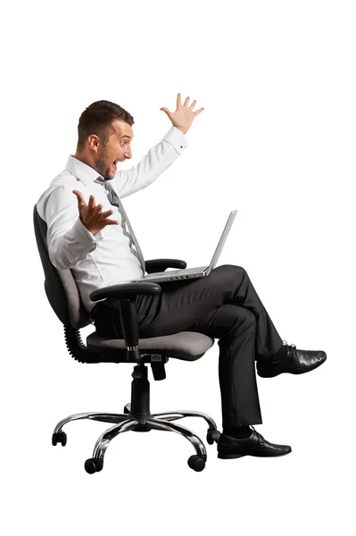 Joyous businessman looking at laptop — Stock Photo, Image