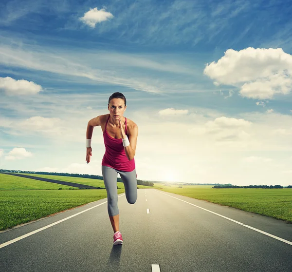 Concentrated woman running — Stock Photo, Image