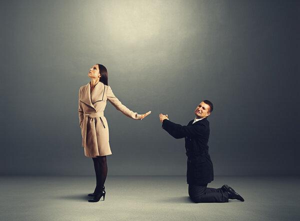 man standing on his knees and apologizing