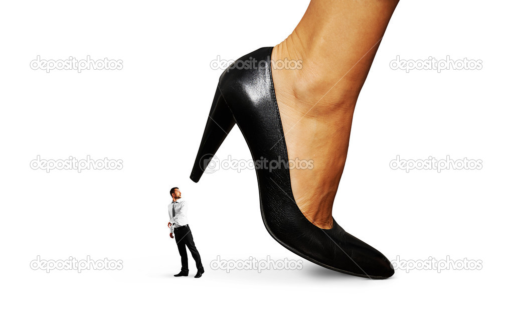 small man under big heel