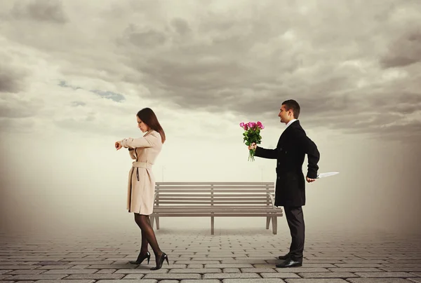 Man with knife standing behind woman — Stock Photo, Image