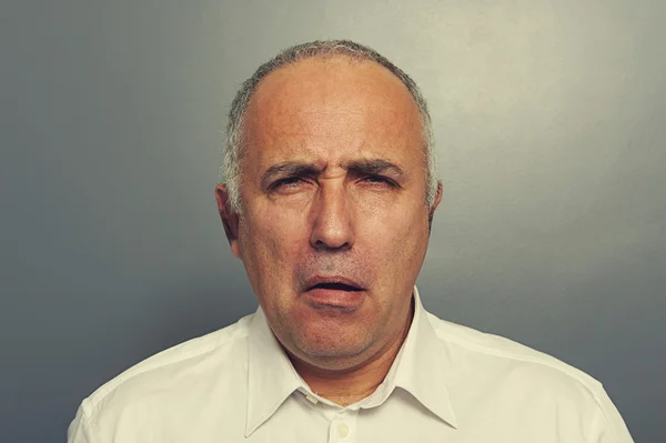 Senior man with silly expression — Stock Photo, Image