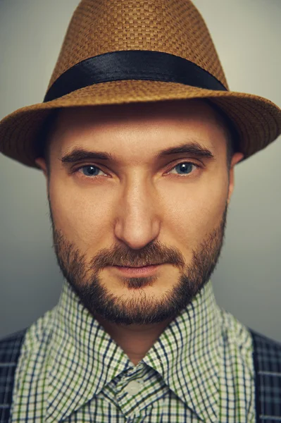 Man in straw hat and checked shirt — Stock Photo, Image