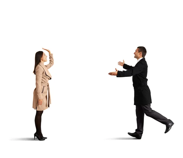 Woman greeting with happy running man — Stock Photo, Image