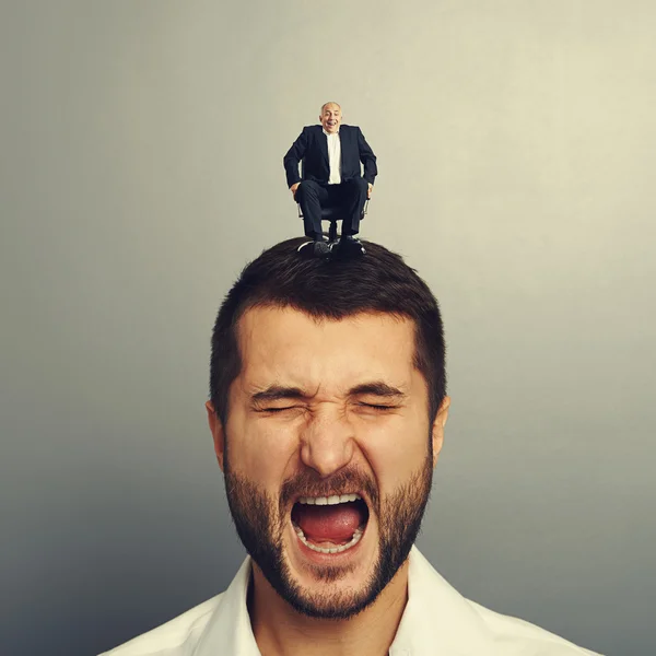 Shocked man with small happy boss — Stock Photo, Image