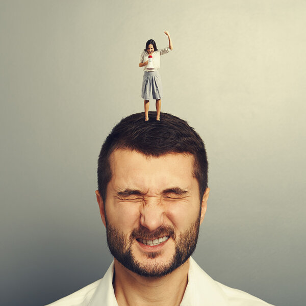 woman shouting at megaphone at dissatisfied man