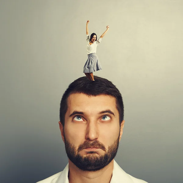 Woman dancing on the head of foolish man — Stock Photo, Image