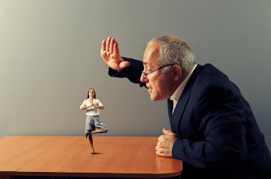 boss is angry at the calm businesswoman clipart
