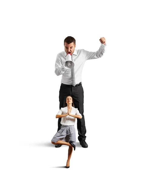 Man screaming at calm meditation woman — Stock Photo, Image