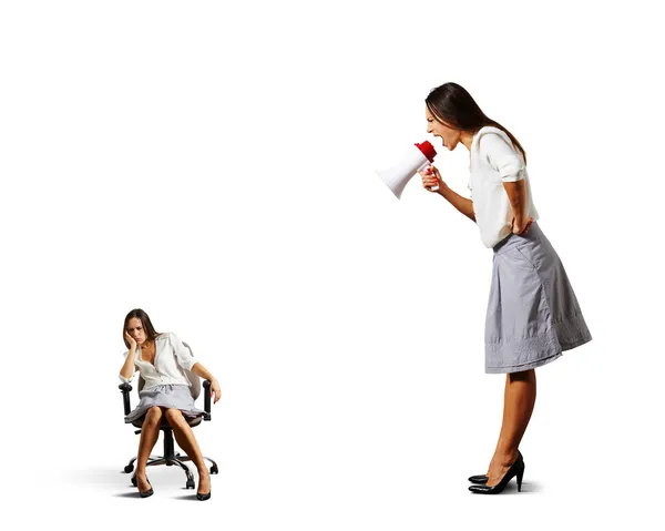 Businesswoman screaming at lazy woman — Stock Photo, Image