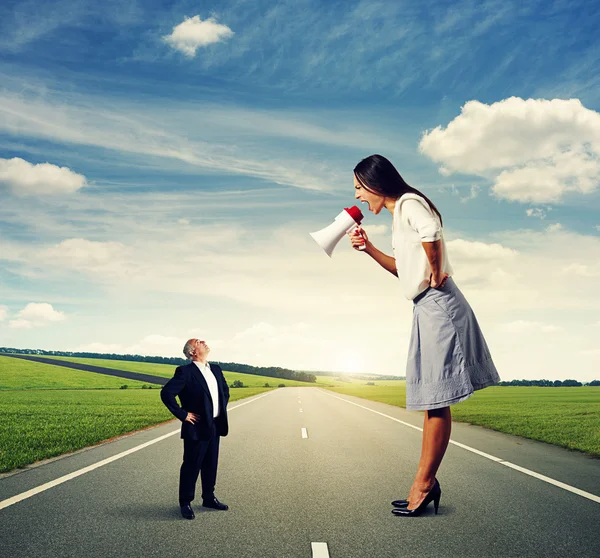 Screaming woman and calm senior man — Stock Photo, Image